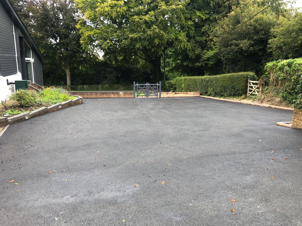 This is a photo of a bitumen driveway which is in the process of being installed by Yass Road Tek